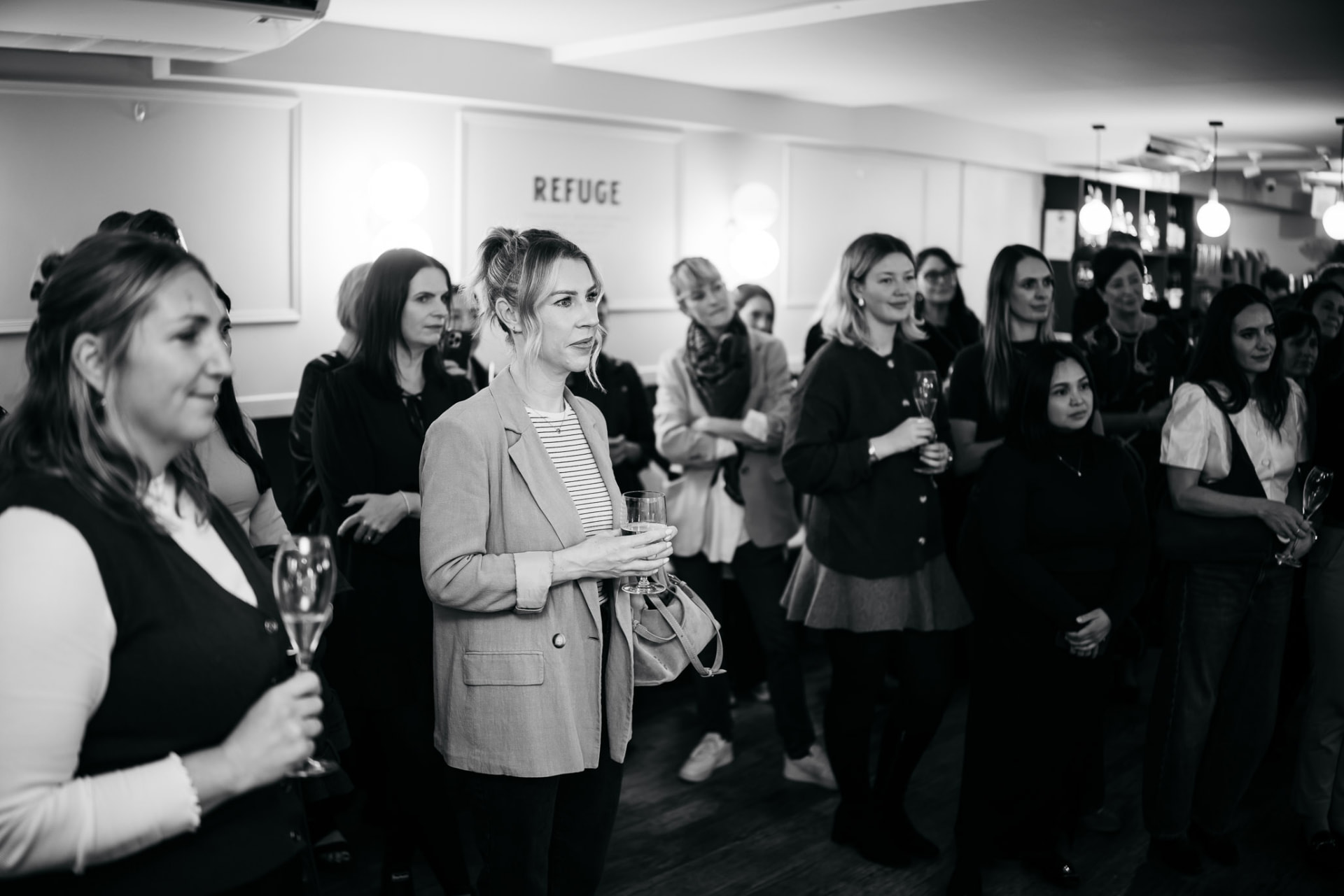 Guests listening during the launch event at Refuge