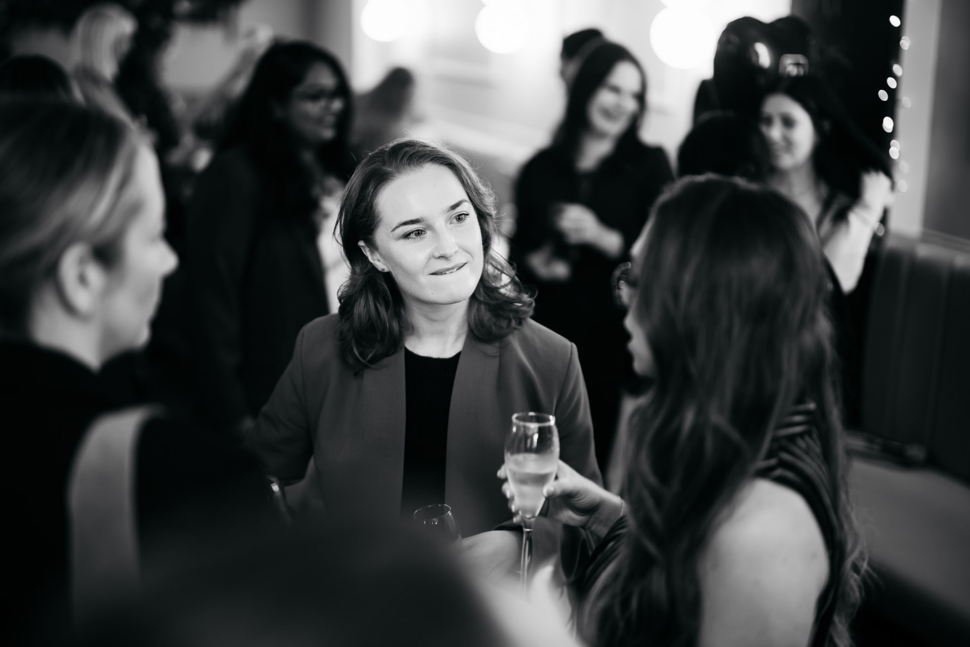 Guests chatting over champagne at the launch